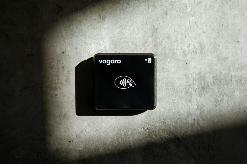 A square-shaped credit card reader is shown.